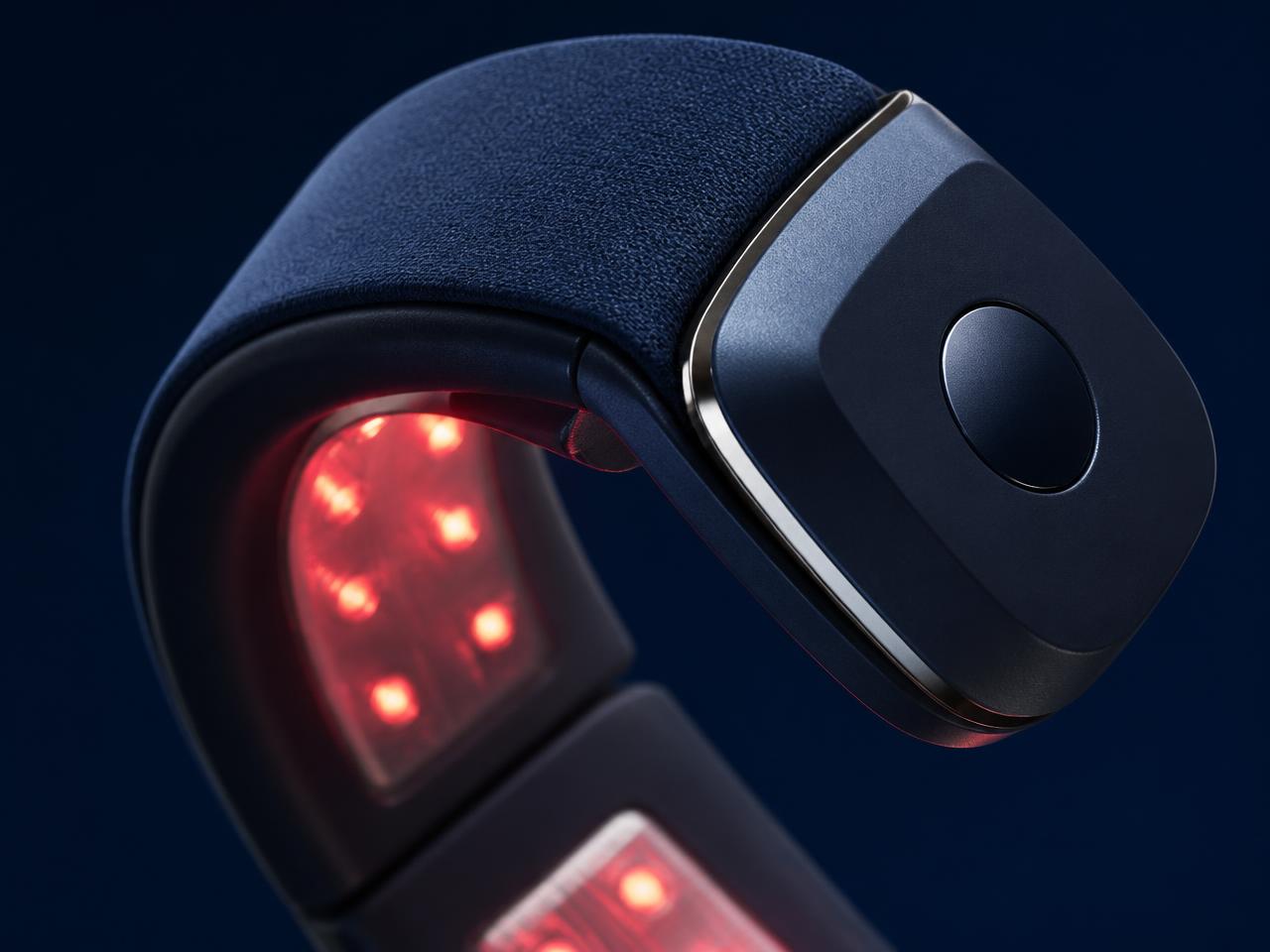 Close-up of the PainEase device showing its red-light therapy modules